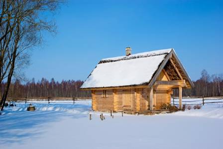 A Lakeside Swedish Log House In The Snow