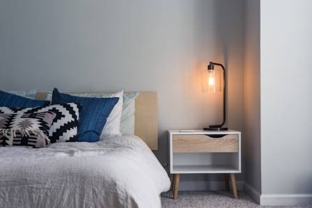 The 2-Inch Rule: Why Your Nightstand Shouldn’t Touch Your Bed